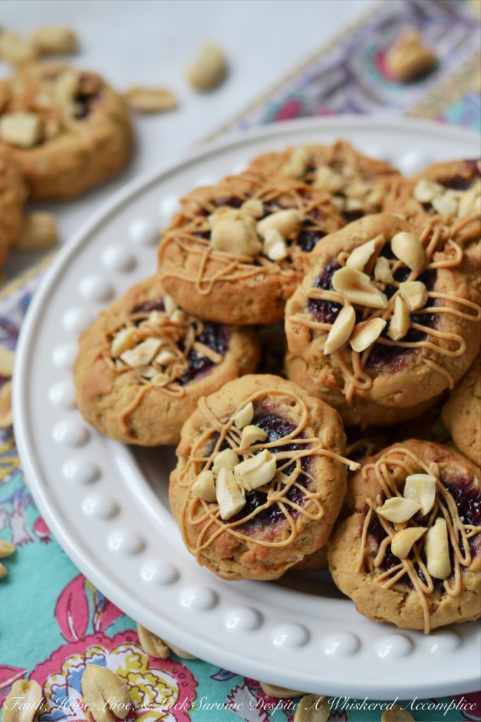 PB&J Banana Oatmeal Thumbprint Cookies - These flavorful thumbprint PB&J cookies are an instant favorite. Serve them for breakfast, as a snack, or even for dessert. With a perfect combination of crunchy, chewy, sweet, and salty, these peanut butter and jelly banana oatmeal thumbprint cookies are sure to be a hit with the whole family.