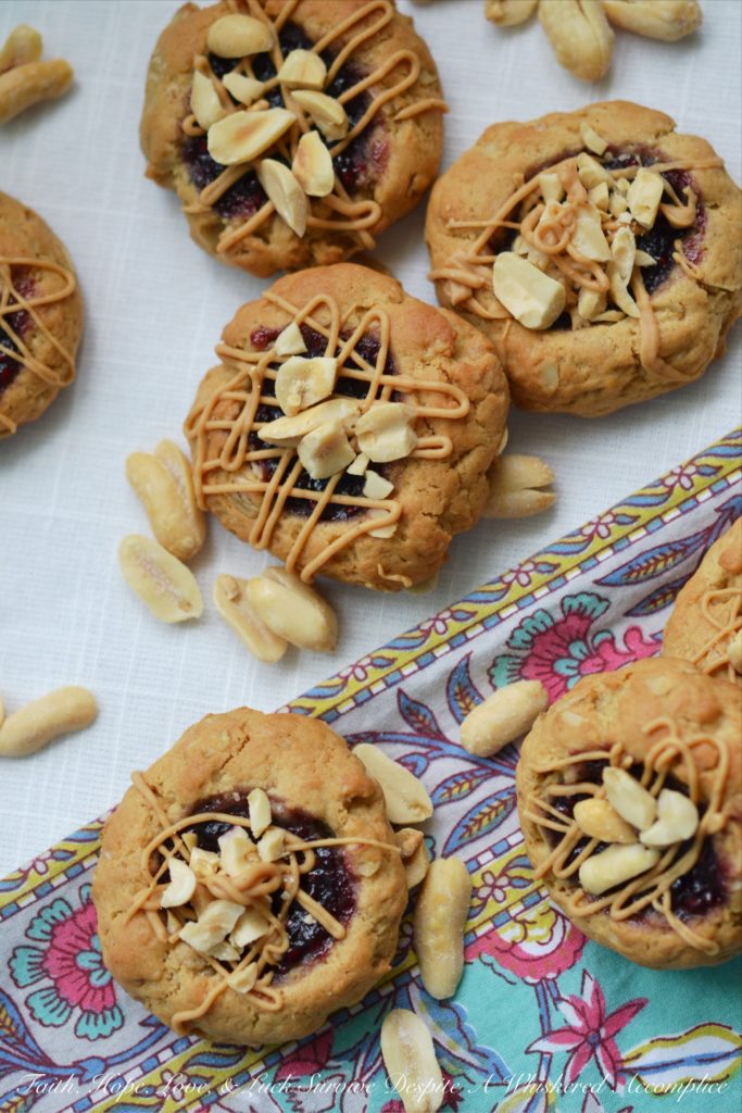 PB&J Banana Oatmeal Thumbprint Cookies - These flavorful thumbprint PB&J cookies are an instant favorite. Serve them for breakfast, as a snack, or even for dessert. With a perfect combination of crunchy, chewy, sweet, and salty, these peanut butter and jelly banana oatmeal thumbprint cookies are sure to be a hit with the whole family.