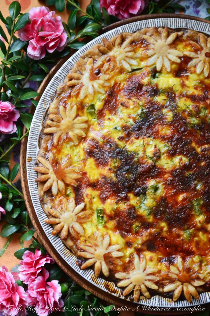Spring Greens Quiche - Some dishes have a way of wrapping you in comfort, speaking straight to your heart, even if they never make the 'health food' hall of fame. Quiche is one of those irresistible classics, with its silky egg filling and golden, flaky crust. This Spring Greens Quiche is a celebration of the season, brimming with crisp asparagus, sweet leeks, and fragrant fennel, so every slice bursts with garden-fresh flavor. Nestle those vibrant Spring greens into a pie crust along with a rich egg custard and a generous layer of cheese, and suddenly eating your veggies feels like a treat.