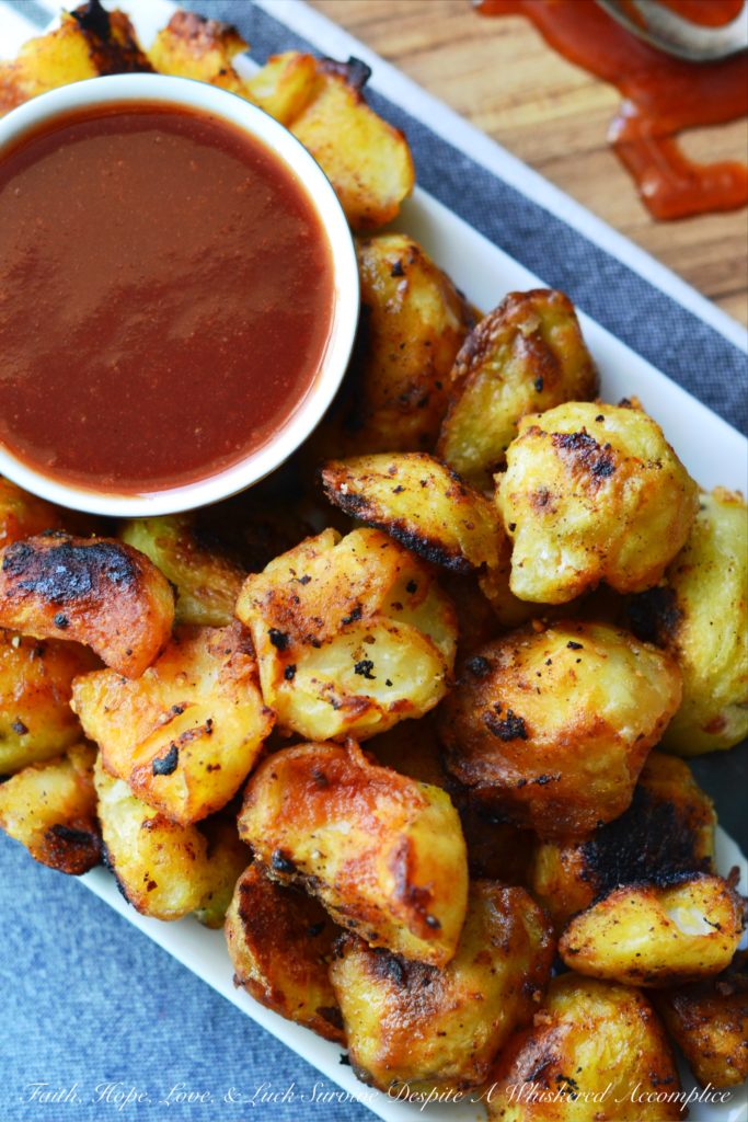 Twice Cooked Potatoes with Spicy Ketchup - Tired of the same boring potato side dishes, week after week? Craving a potato recipe with a bit more pizzazz? These twice-cooked potatoes are boiled to fluffy perfection, then roasted to a golden crisp, before finally being drizzled with and served alongside a ridiculously addictive spicy ketchup jazzed up with brown sugar, vinegar, and a fiery kick of hot sauce. These heavenly boiled and roasted potatoes are sure to have you licking your plate clean.