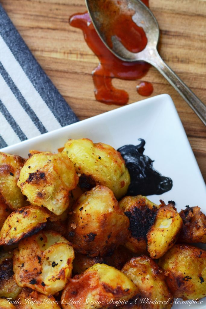 Twice Cooked Potatoes with Spicy Ketchup - Tired of the same boring potato side dishes, week after week? Craving a potato recipe with a bit more pizzazz? These twice-cooked potatoes are boiled to fluffy perfection, then roasted to a golden crisp, before finally being drizzled with and served alongside a ridiculously addictive spicy ketchup jazzed up with brown sugar, vinegar, and a fiery kick of hot sauce. These heavenly boiled and roasted potatoes are sure to have you licking your plate clean.