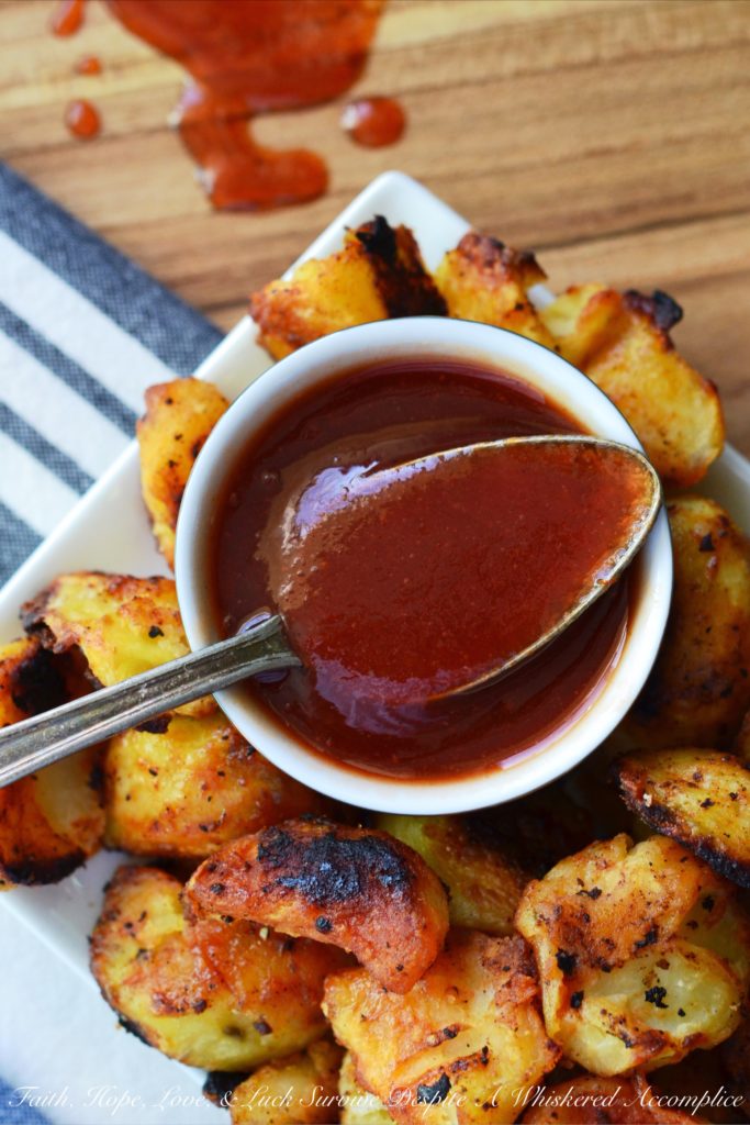 Twice Cooked Potatoes with Spicy Ketchup - Tired of the same boring potato side dishes, week after week? Craving a potato recipe with a bit more pizzazz? These twice-cooked potatoes are boiled to fluffy perfection, then roasted to a golden crisp, before finally being drizzled with and served alongside a ridiculously addictive spicy ketchup jazzed up with brown sugar, vinegar, and a fiery kick of hot sauce. These heavenly boiled and roasted potatoes are sure to have you licking your plate clean.