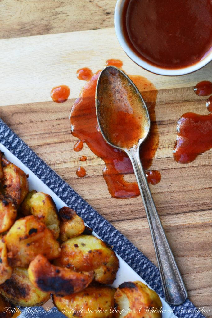 Twice Cooked Potatoes with Spicy Ketchup - Tired of the same boring potato side dishes, week after week? Craving a potato recipe with a bit more pizzazz? These twice-cooked potatoes are boiled to fluffy perfection, then roasted to a golden crisp, before finally being drizzled with and served alongside a ridiculously addictive spicy ketchup jazzed up with brown sugar, vinegar, and a fiery kick of hot sauce. These heavenly boiled and roasted potatoes are sure to have you licking your plate clean.