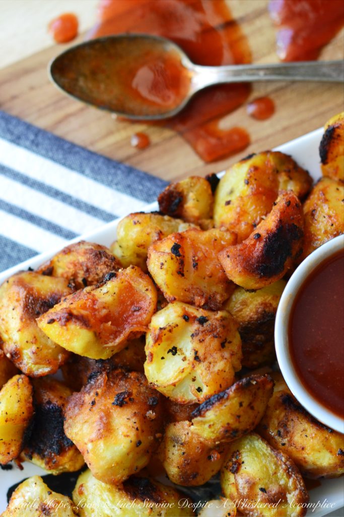 Twice Cooked Potatoes with Spicy Ketchup - Tired of the same boring potato side dishes, week after week? Craving a potato recipe with a bit more pizzazz? These twice-cooked potatoes are boiled to fluffy perfection, then roasted to a golden crisp, before finally being drizzled with and served alongside a ridiculously addictive spicy ketchup jazzed up with brown sugar, vinegar, and a fiery kick of hot sauce. These heavenly boiled and roasted potatoes are sure to have you licking your plate clean.