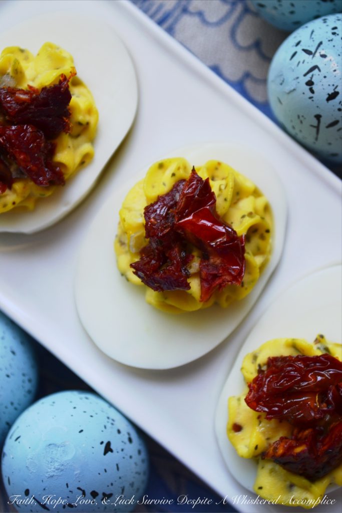 Simple Sun-Dried Tomato Deviled Eggs - This Easter, give your deviled eggs an Italian twist by adding Italian herb mix and garnishing them with sun-dried tomatoes.
