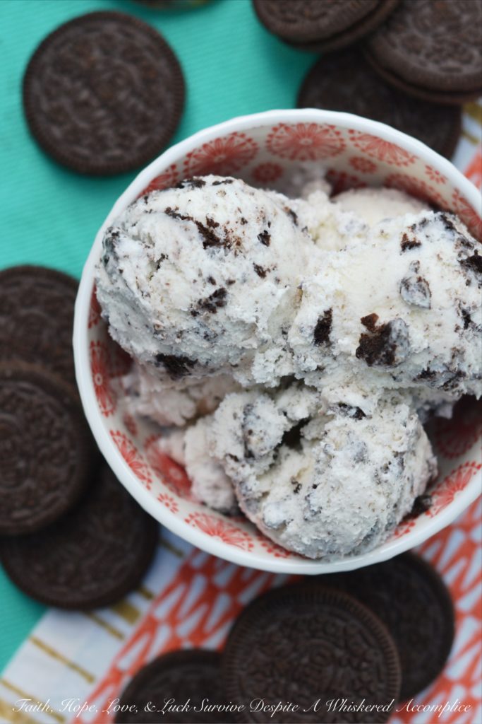 Garden Mint Cookies and Cream Ice Cream - This delicious cookies and cream ice cream is perfect for cooling down in the summertime. Fresh garden mint and crushed chocolate sandwich cookies come together in this ice cream to create the most amazing creamy and super minty frozen summer treat.