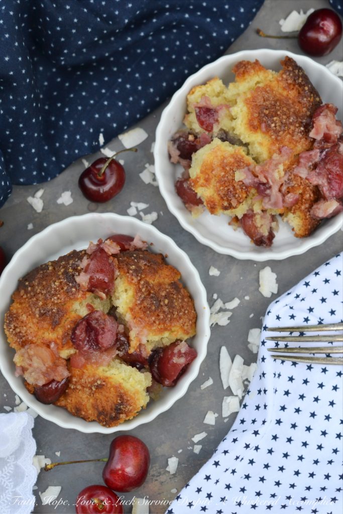 Drunken Sailor Coconut Cherry Cobbler - Who wouldn't love a drunken, fruit-enrobed, crunchy, sweet, cherry cobbler pillowy dough cloud? Coconut extract, unsweetened shredded coconut, and dark rum help to make this cherry cobbler one that any drunken sailor would willingly brave the seas for.