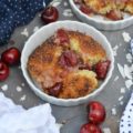 Drunken Sailor Coconut Cherry Cobbler - Who wouldn't love a drunken, fruit-enrobed, crunchy, sweet, cherry cobbler pillowy dough cloud? Coconut extract, unsweetened shredded coconut, and dark rum help to make this cherry cobbler one that any drunken sailor would willingly brave the seas for.