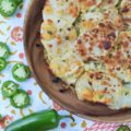 Jalapeño & Cotija Cheese Potato Stack Pie - Pie isn't just for dessert anymore. Stacking thinly sliced potatoes with layers of minced jalapeños and crumbled cotija cheese, to make a potato stack pie, helps turn ordinary spuds into something truly spectacular, especially when served with salsa and sour cream.