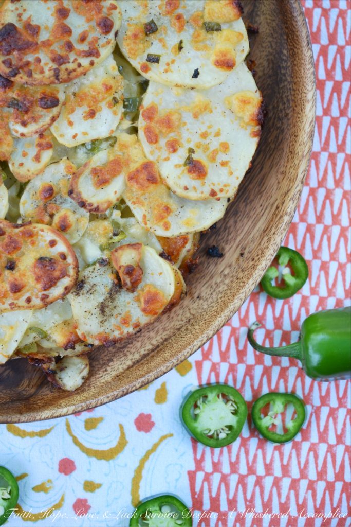 Jalapeño & Cotija Cheese Potato Stack Pie - Pie isn't just for dessert anymore. Stacking thinly sliced potatoes with layers of minced jalapeños and crumbled cotija cheese, to make a potato stack pie, helps turn ordinary spuds into something truly spectacular, especially when served with salsa and sour cream.