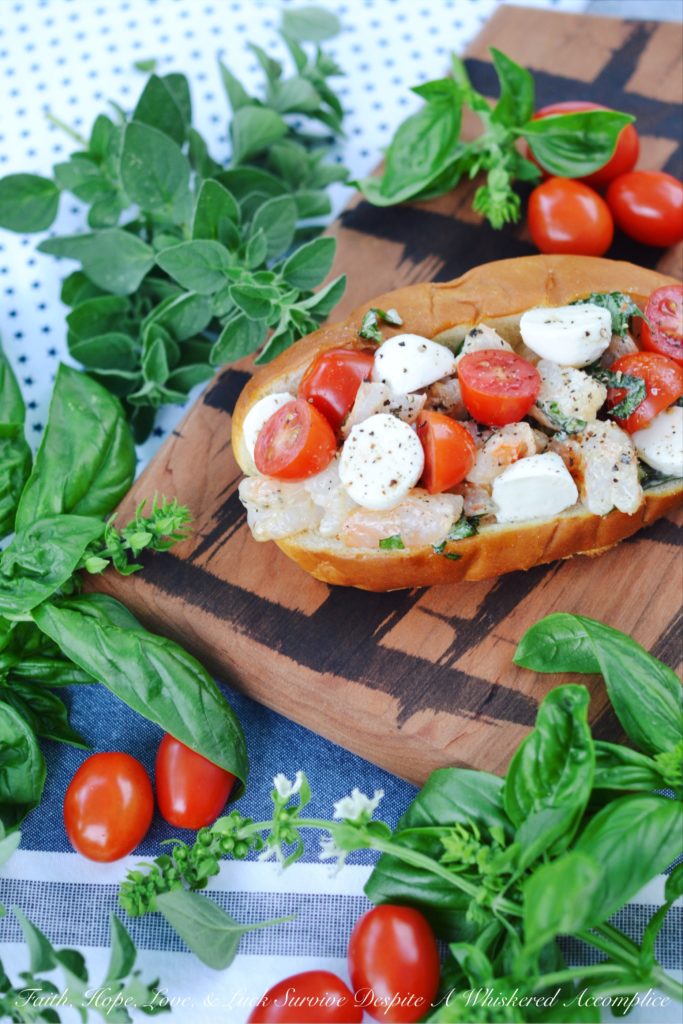 Summer Caprese Shrimp Salad Roll - Shrimp, ripe tomatoes, basil, and fresh mozzarella come together with just a hint of mayonnaise to make the most delicious shrimp roll you've ever tasted.