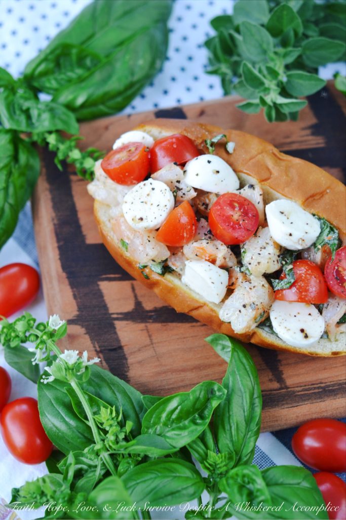 Summer Caprese Shrimp Salad Roll - Shrimp, ripe tomatoes, basil, and fresh mozzarella come together with just a hint of mayonnaise to make the most delicious shrimp roll you've ever tasted.