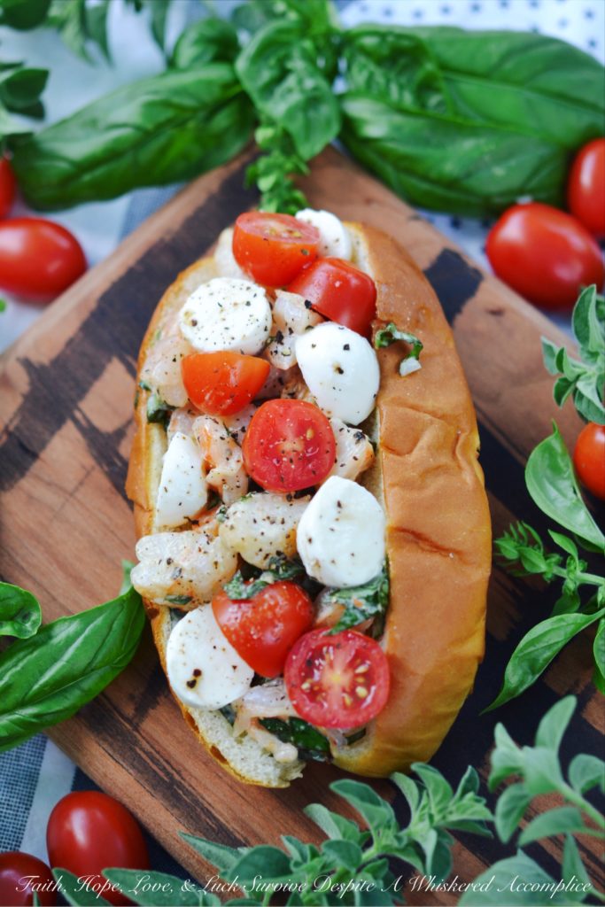 Summer Caprese Shrimp Salad Roll - Shrimp, ripe tomatoes, basil, and fresh mozzarella come together with just a hint of mayonnaise to make the most delicious shrimp roll you've ever tasted.