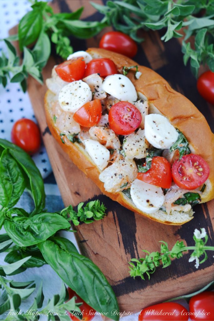 Summer Caprese Shrimp Salad Roll - Shrimp, ripe tomatoes, basil, and fresh mozzarella come together with just a hint of mayonnaise to make the most delicious shrimp roll you've ever tasted.