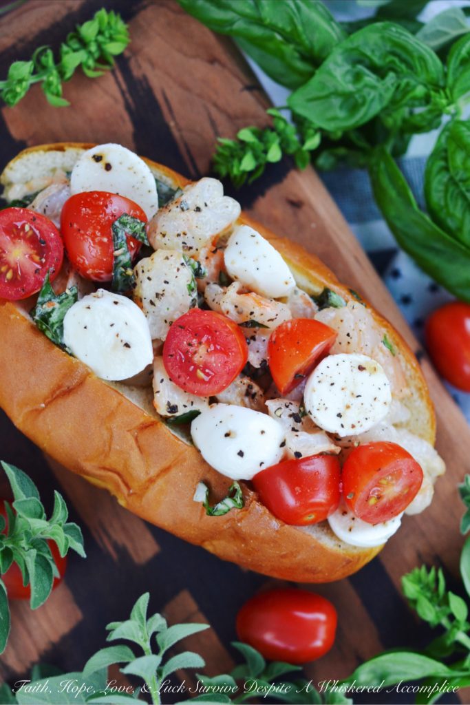 Summer Caprese Shrimp Salad Roll - Shrimp, ripe tomatoes, basil, and fresh mozzarella come together with just a hint of mayonnaise to make the most delicious shrimp roll you've ever tasted.