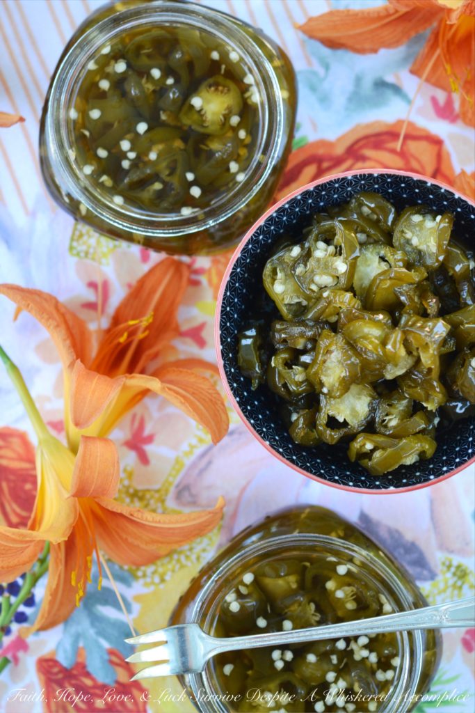 Candied Sliced Jalapeños - Add a little bit of sweet heat to all of your favorite summer sandwiches, salads, and appetizers with these sweet and spicy candied sliced jalapeños. These flavorful jalapeño slices take less than 20 minutes to cook and last up to 1 month in your refrigerator. I guarantee that you're going to want to use them on and in just about everything you make.