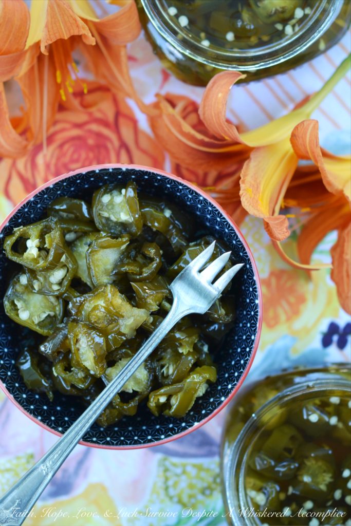 Candied Sliced Jalapeños - Add a little bit of sweet heat to all of your favorite summer sandwiches, salads, and appetizers with these sweet and spicy candied sliced jalapeños. These flavorful jalapeño slices take less than 20 minutes to cook and last up to 1 month in your refrigerator. I guarantee that you're going to want to use them on and in just about everything you make.