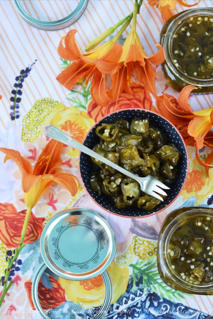 Candied Sliced Jalapeños - Add a little bit of sweet heat to all of your favorite summer sandwiches, salads, and appetizers with these sweet and spicy candied sliced jalapeños. These flavorful jalapeño slices take less than 20 minutes to cook and last up to 1 month in your refrigerator. I guarantee that you're going to want to use them on and in just about everything you make.