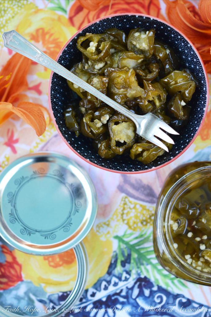Candied Sliced Jalapeños - Add a little bit of sweet heat to all of your favorite summer sandwiches, salads, and appetizers with these sweet and spicy candied sliced jalapeños. These flavorful jalapeño slices take less than 20 minutes to cook and last up to 1 month in your refrigerator. I guarantee that you're going to want to use them on and in just about everything you make.