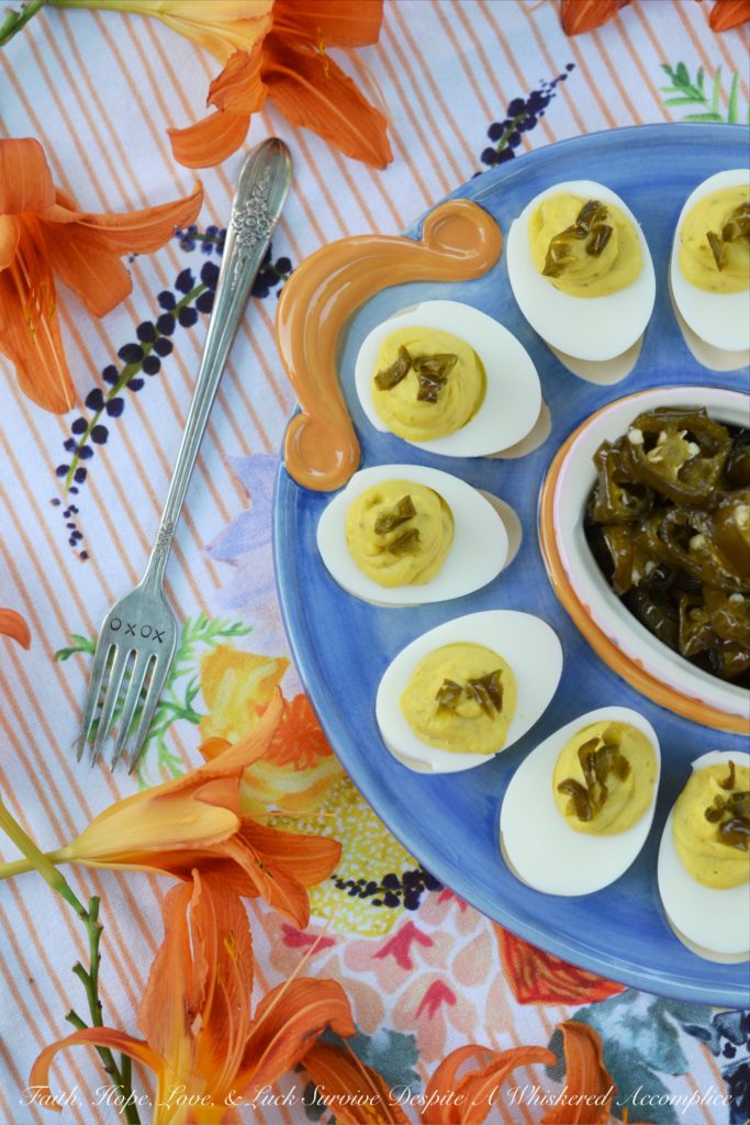 Sweet & Spicy Candied Jalapeño Deviled Eggs - These amazing deviled eggs are a little bit sweet and a little bit spicy, thanks to the addition of finely chopped candied sliced jalapeños. And, whether or not you make your own candied jalapeño slices or buy them from your local market, these eggs will definitely make a great addition to your next cookout, picnic, or family gathering.