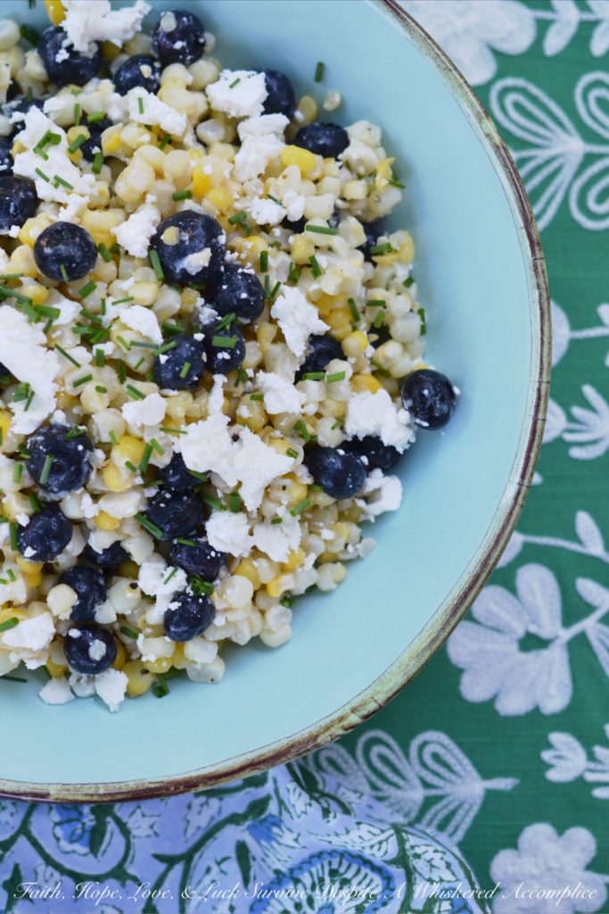 White Balsamic Blueberry, Corn, and Feta Salad - Fresh corn, plump blueberries, and feta cheese come together to make the perfect summer salad when combined with a white balsamic dressing.