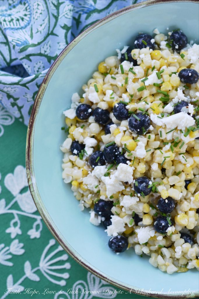 White Balsamic Blueberry, Corn, and Feta Salad - Fresh corn, plump blueberries, and feta cheese come together to make the perfect summer salad when combined with a white balsamic dressing.