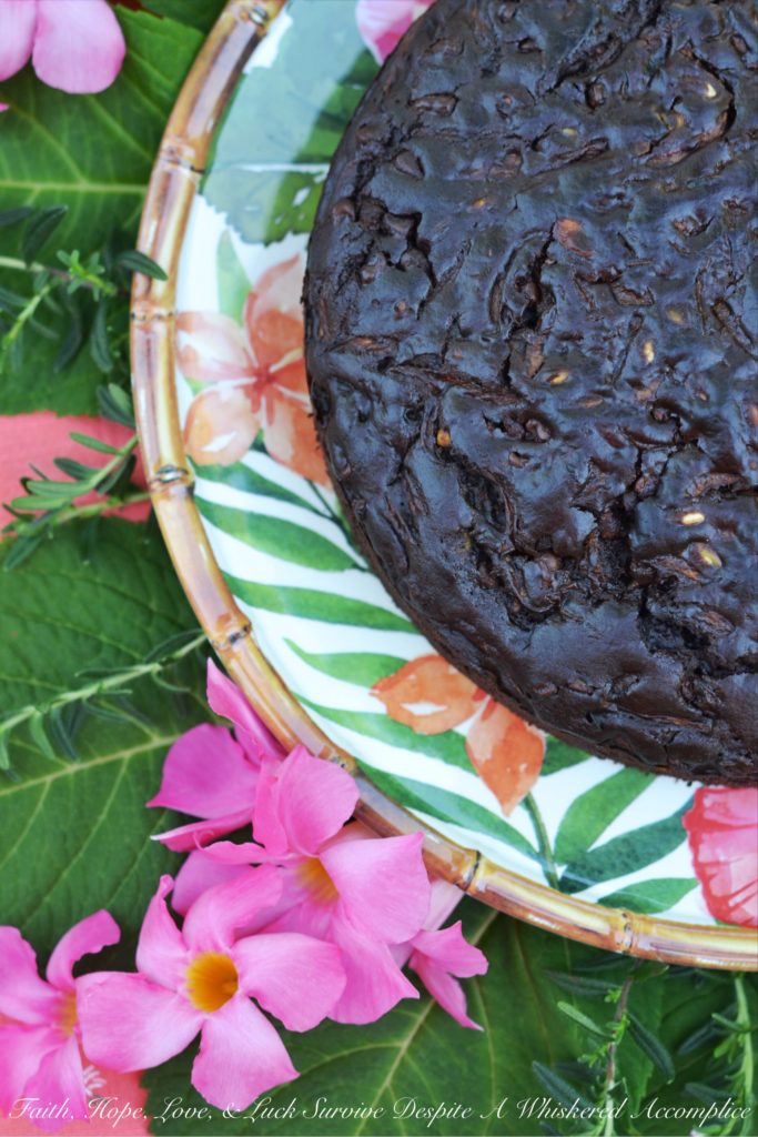 Chocolate Zucchini Bread Pumpkin Seed Cake - This chocolate zucchini bread is really more of a cake with its moist rich texture, salty pumpkin seed crunch, and mega-dose of gooey chocolate chips. During those summer months, when zucchini is so easy to come by, it's the perfect chocolaty dessert or sweet breakfast treat.