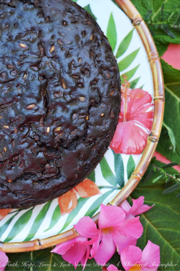 Chocolate Zucchini Bread Pumpkin Seed Cake - This chocolate zucchini bread is really more of a cake with its moist rich texture, salty pumpkin seed crunch, and mega-dose of gooey chocolate chips. During those summer months, when zucchini is so easy to come by, it's the perfect chocolaty dessert or sweet breakfast treat.