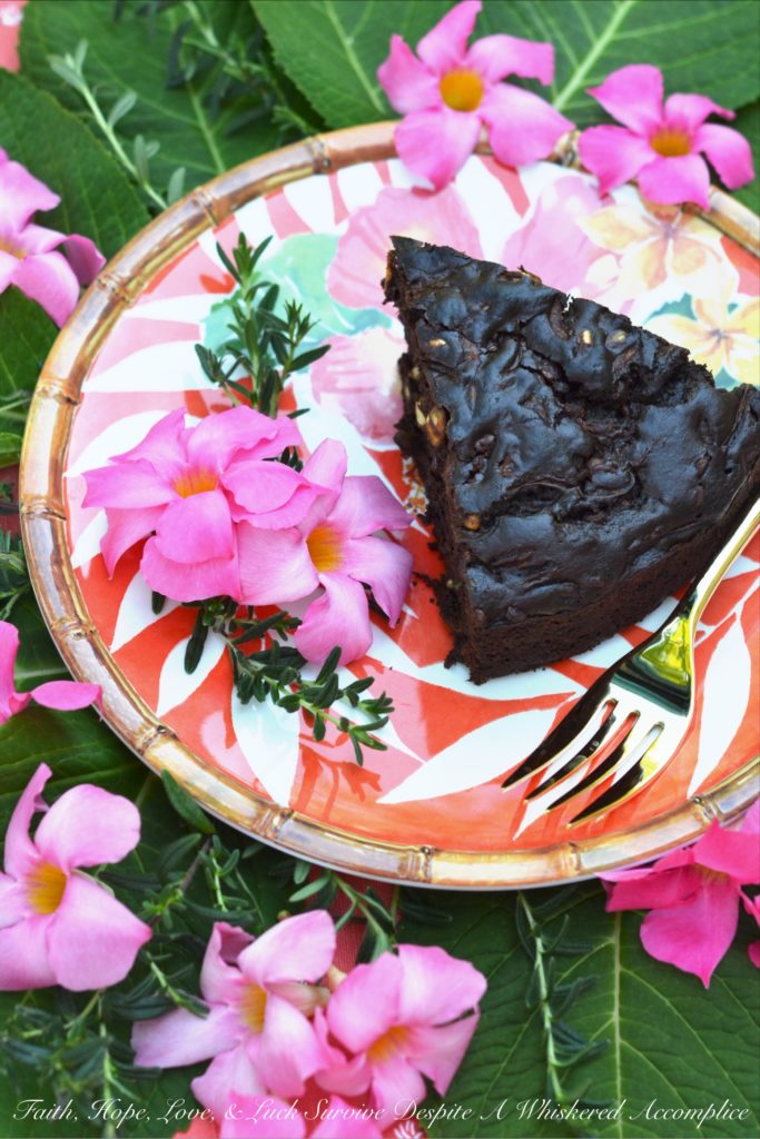 Chocolate Zucchini Bread Pumpkin Seed Cake - This chocolate zucchini bread is really more of a cake with its moist rich texture, salty pumpkin seed crunch, and mega-dose of gooey chocolate chips. During those summer months, when zucchini is so easy to come by, it's the perfect chocolaty dessert or sweet breakfast treat.