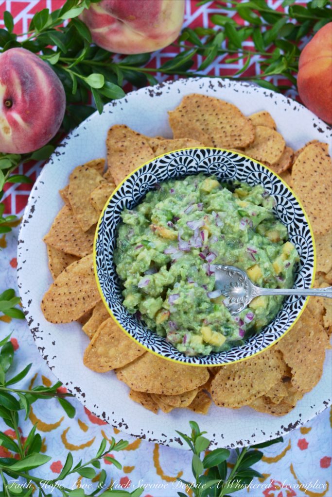 Not Too Spicy Peach Jalapeño Guacamole - Fresh jalapeño and summer-ripe peaches give this creamy guacamole so much flavor. And while this guacamole has a little bit of a kick from the jalapeño, it's not so spicy that it will burn your taste buds off.