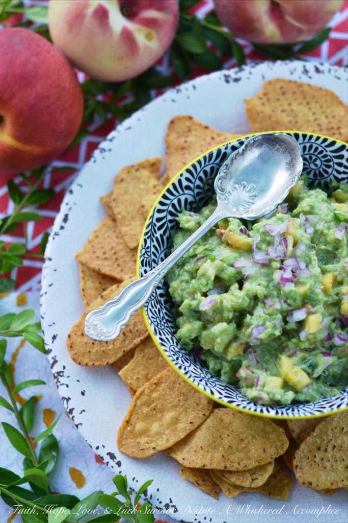 Not Too Spicy Peach Jalapeño Guacamole - Fresh jalapeño and summer-ripe peaches give this creamy guacamole so much flavor. And while this guacamole has a little bit of a kick from the jalapeño, it's not so spicy that it will burn your taste buds off.