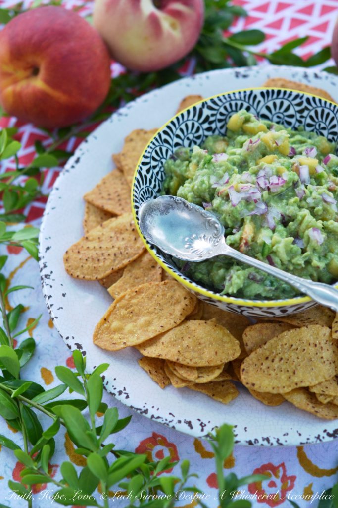 Not Too Spicy Peach Jalapeño Guacamole - Fresh jalapeño and summer-ripe peaches give this creamy guacamole so much flavor. And while this guacamole has a little bit of a kick from the jalapeño, it's not so spicy that it will burn your taste buds off.