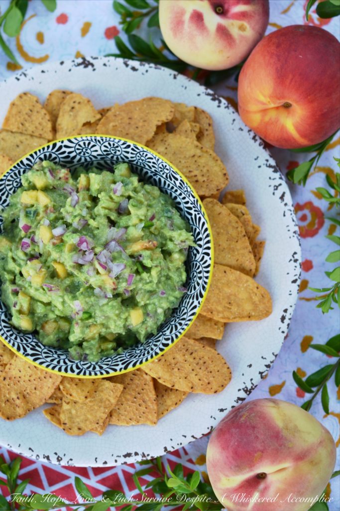 Not Too Spicy Peach Jalapeño Guacamole - Fresh jalapeño and summer-ripe peaches give this creamy guacamole so much flavor. And while this guacamole has a little bit of a kick from the jalapeño, it's not so spicy that it will burn your taste buds off.