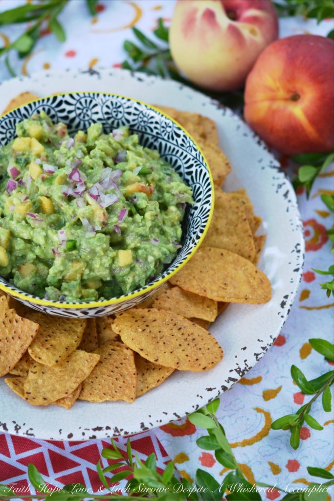 Not Too Spicy Peach Jalapeño Guacamole - Fresh jalapeño and summer-ripe peaches give this creamy guacamole so much flavor. And while this guacamole has a little bit of a kick from the jalapeño, it's not so spicy that it will burn your taste buds off.