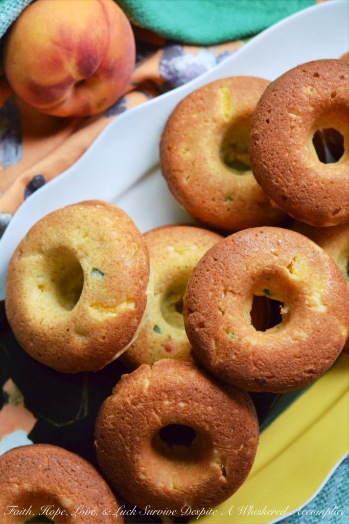 Jalapeño and Peach Cornbread Dinner Donuts - Donuts aren't just for breakfast anymore. Diced jalapeño and peaches make these cornbread dinner donuts a particularly delicious treat with just the right hint of sweet and spicy flavor. They're definitely worth trying out if you're looking for a unique and delicious dinner treat.