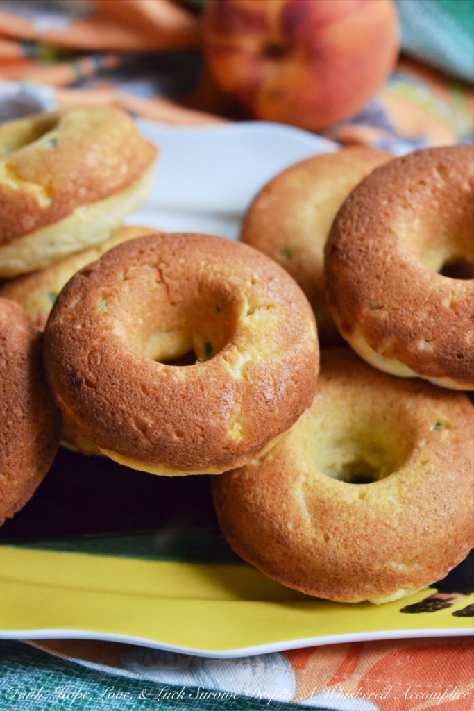Jalapeño and Peach Cornbread Dinner Donuts - Donuts aren't just for breakfast anymore. Diced jalapeño and peaches make these cornbread dinner donuts a particularly delicious treat with just the right hint of sweet and spicy flavor. They're definitely worth trying out if you're looking for a unique and delicious dinner treat.