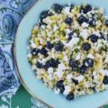 Fresh corn, plump blueberries, and feta cheese come together to make the perfect summer salad when combined with a white balsamic dressing.