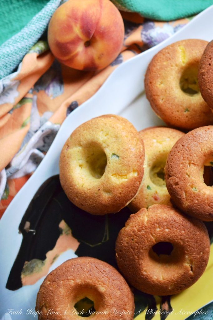Diced jalapeño and peaches make these cornbread dinner donuts a particularly delicious treat with just the right hint of sweet and spicy flavor.