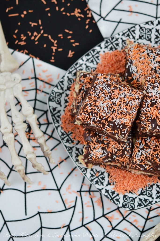 Fluffy Peanut Butter Nougat Chocolate Brownies - These moist and decadent brownies are topped with fluffy peanut butter nougat and peanuts, before being spread with a thick heavenly chocolate icing.