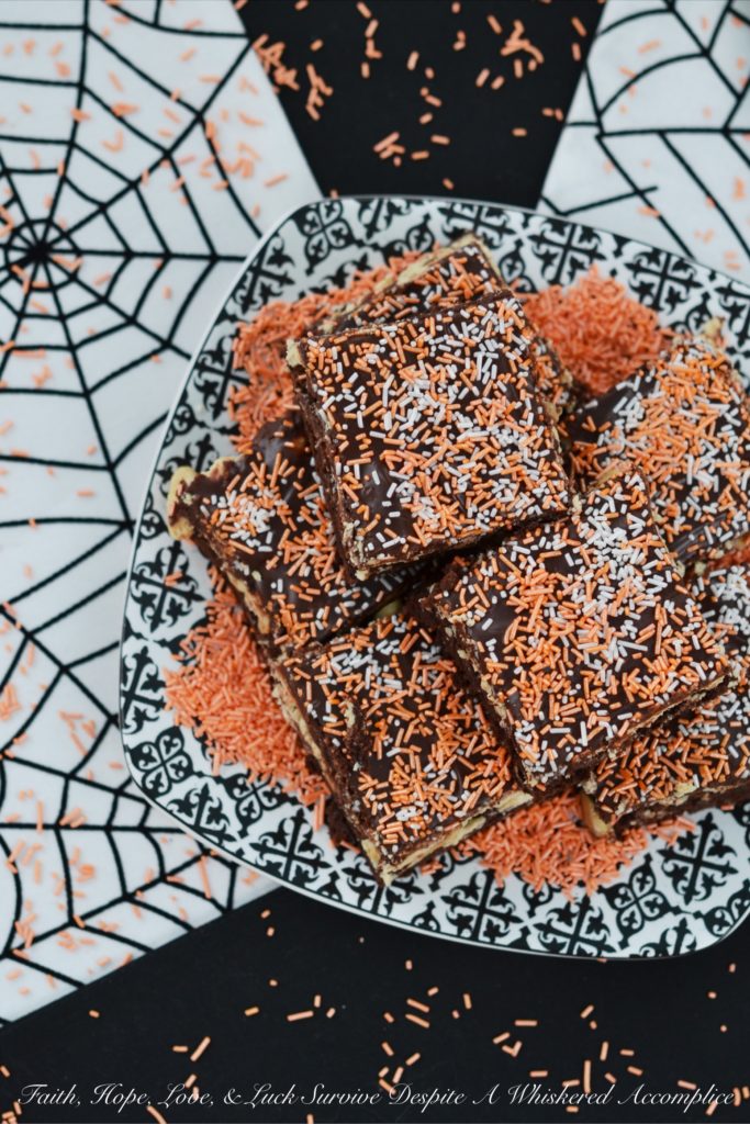 Fluffy Peanut Butter Nougat Chocolate Brownies - These moist and decadent brownies are topped with fluffy peanut butter nougat and peanuts, before being spread with a thick heavenly chocolate icing.