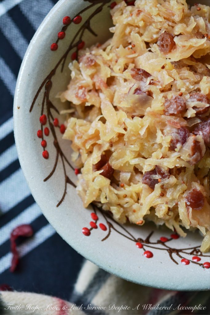 Sweet Cranberry Slow Cooker Sauerkraut - Imagine sauerkraut all dressed up in its holiday best, simmering away in a slow cooker with beer, maple syrup, brown sugar, and dried cranberries.