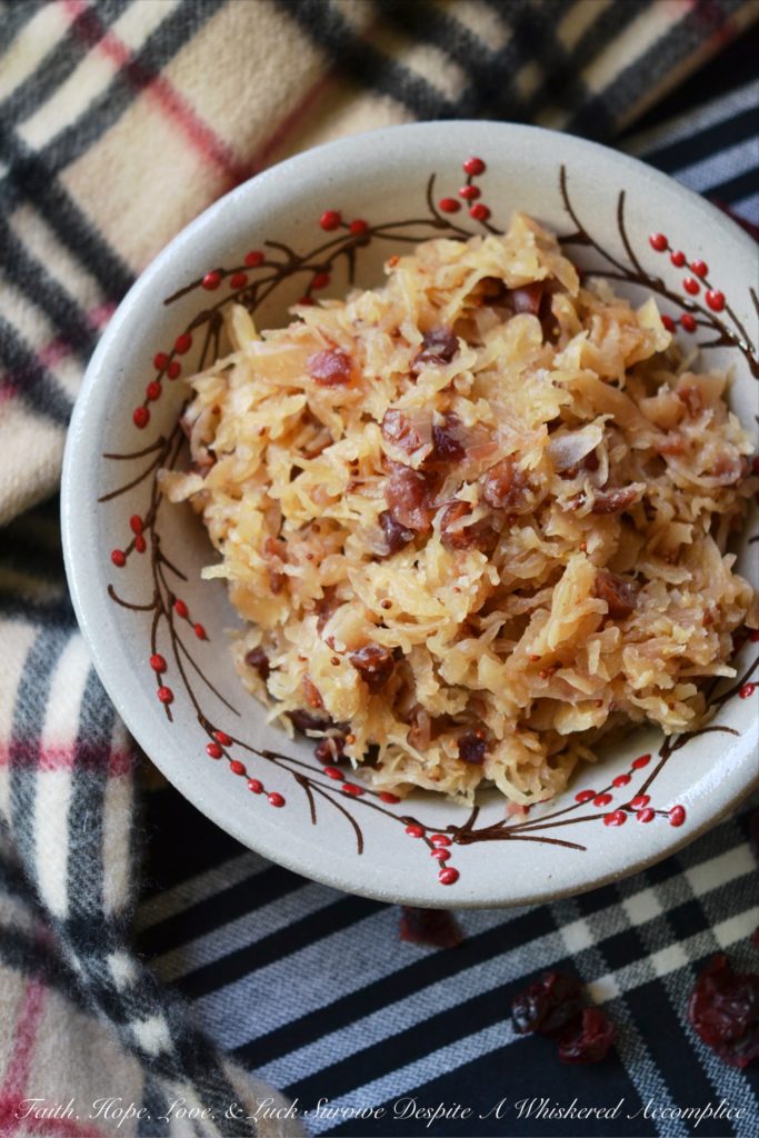 Sweet Cranberry Slow Cooker Sauerkraut - Imagine sauerkraut all dressed up in its holiday best, simmering away in a slow cooker with beer, maple syrup, brown sugar, and dried cranberries.