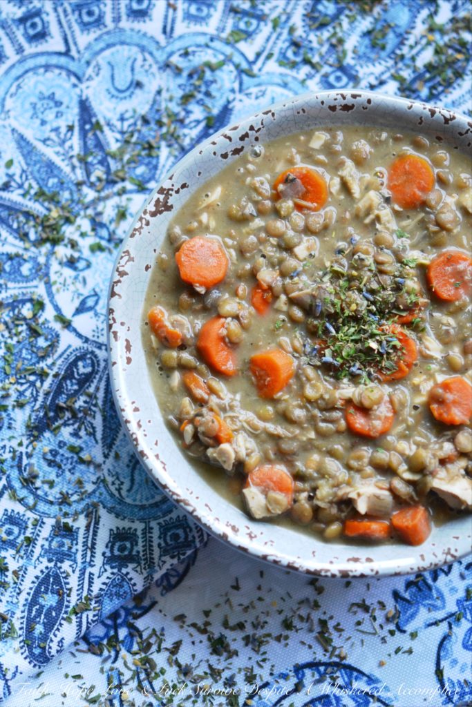 French Lentil and Carrot Crockpot Soup - How can so few ingredients result in such an amazing bowl of lentil soup? It's almost mind-boggling. This filling crockpot or slow-cooker soup recipe, containing rotisserie chicken, carrots, lentils, and Herbes de Provence, is sure to be an instant recipe hit with your family. They'll be delighted with its taste and you'll absolutely adore how easy it is to make on a busy weeknight.