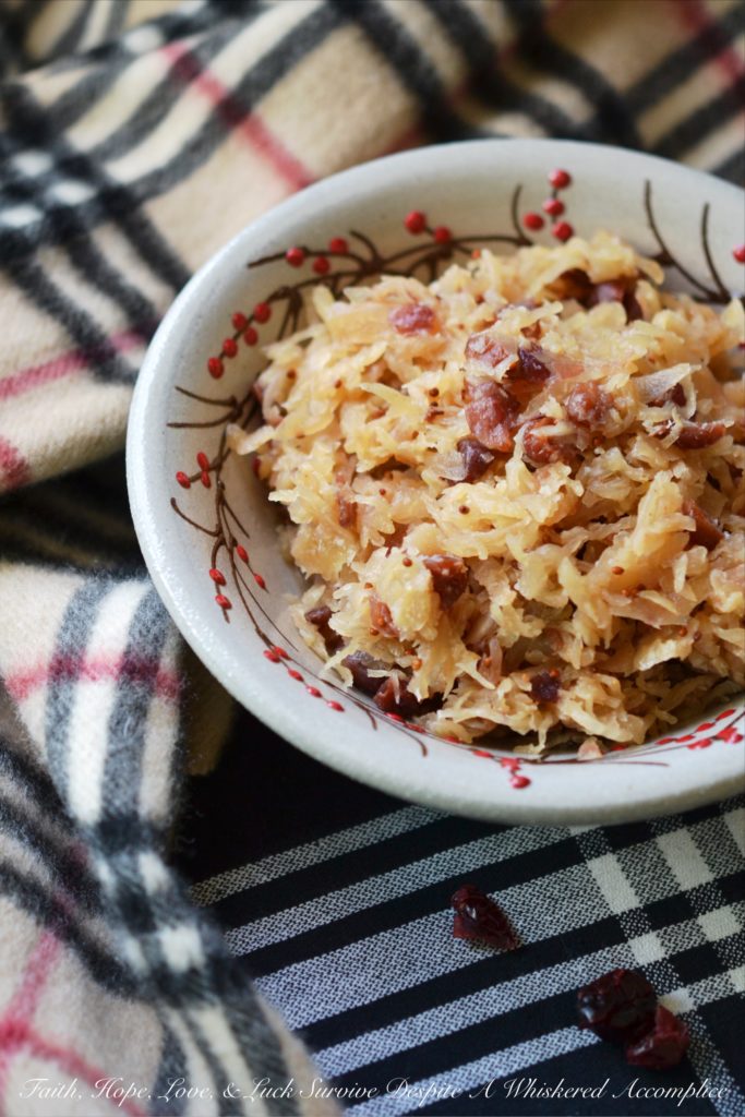 Sweet Cranberry Slow Cooker Sauerkraut - Imagine sauerkraut all dressed up in its holiday best, simmering away in a slow cooker with beer, maple syrup, brown sugar, and dried cranberries.