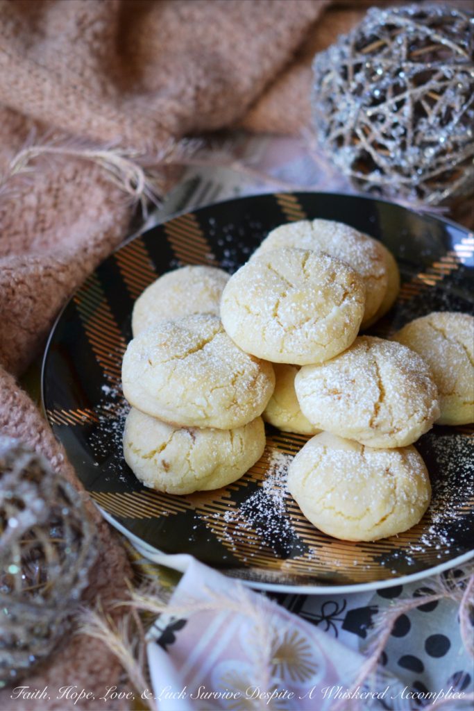 Lemon Ginger Crinkle Cookies - Lemon and ginger add a unique twist to these traditional crinkle cookies, making each bite sweet, tart, and just a little bit spicy.