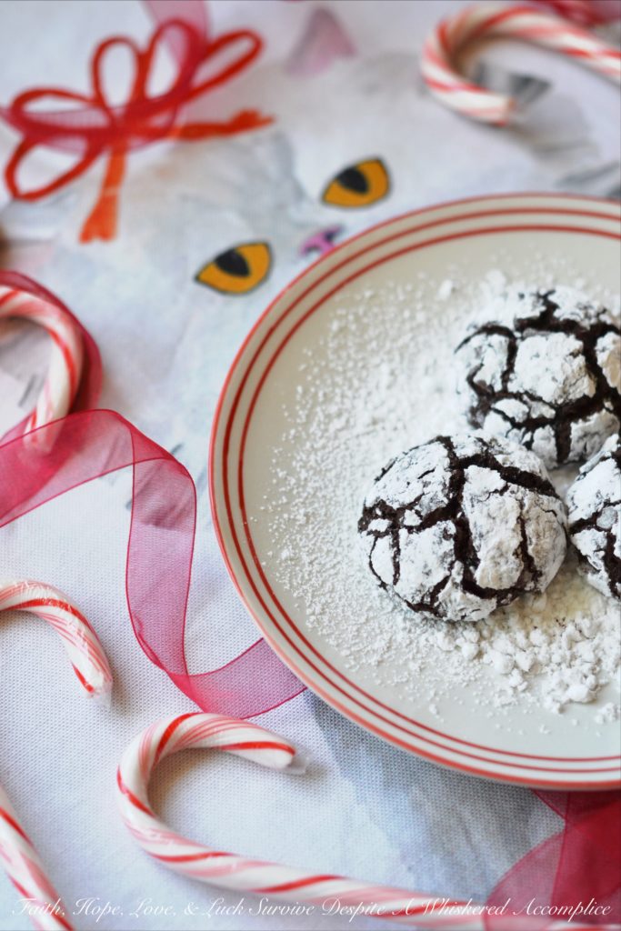 Mexican Chocolate Chip Crinkle Cookies - A hint of cinnamon and spice make these traditional Christmas chocolate chip crinkle cookies coated in powdered sugar a real holiday treat.