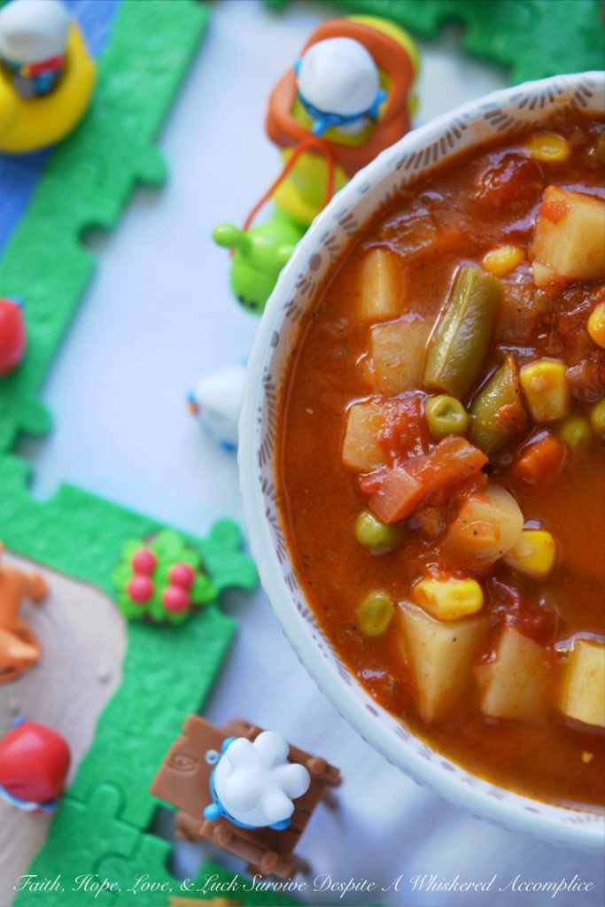 Classic Childhood Vegetable Soup - This classic childhood vegetable soup is loaded with potatoes, carrots, corn, green beans, peas, and onions. Its rich tomato base is prepared using tomato paste, low-sodium beef broth, and a can of crushed tomatoes. With the addition of a sweet yellow onion, a few red potatoes, and a bag of frozen mixed vegetables, this classic childhood favorite gets an extra boost of flavor and nutrition. Add in a couple of bay leaves, a sprinkle of salt and pepper, and you’ve got yourself a big ol’ pot of simple, soul-soothing homemade soup. It's comfort food at its best.