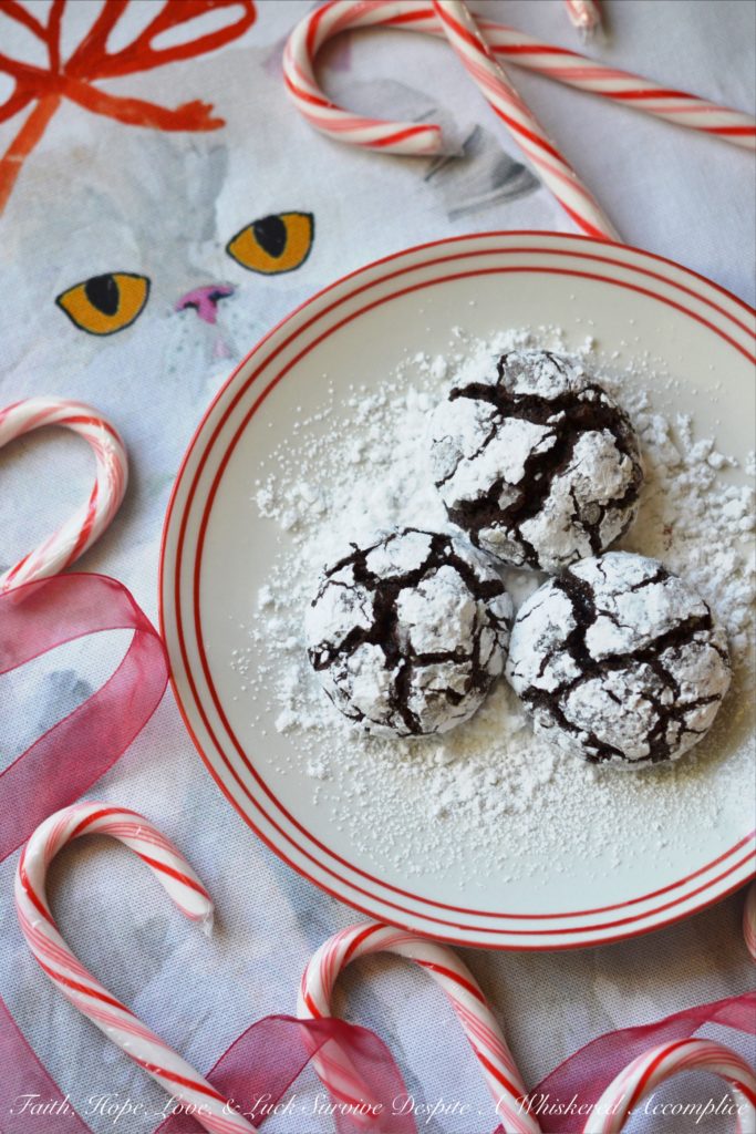 Mexican Chocolate Chip Crinkle Cookies - A hint of cinnamon and spice make these traditional Christmas chocolate chip crinkle cookies coated in powdered sugar a real holiday treat.