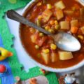 Classic Childhood Vegetable Soup - This classic childhood vegetable soup is loaded with potatoes, carrots, corn, green beans, peas, and onions. Its rich tomato base is prepared using tomato paste, low-sodium beef broth, and a can of crushed tomatoes. With the addition of a sweet yellow onion, a few red potatoes, and a bag of frozen mixed vegetables, this classic childhood favorite gets an extra boost of flavor and nutrition. Add in a couple of bay leaves, a sprinkle of salt and pepper, and you’ve got yourself a big ol’ pot of simple, soul-soothing homemade soup. It's comfort food at its best.