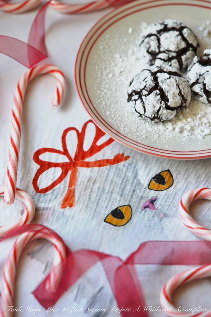 Mexican Chocolate Chip Crinkle Cookies - A hint of cinnamon and spice make these traditional Christmas chocolate chip crinkle cookies coated in powdered sugar a real holiday treat.